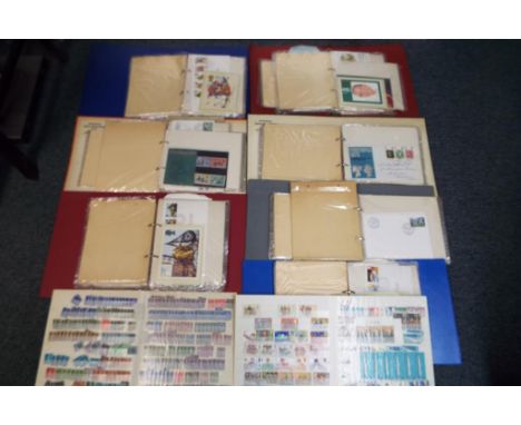 Philately - Six albums containing a quantity of first day covers and two further albums containing used stamps. This lot MUST