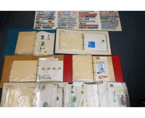 Philately - Six albums containing a quantity of first day covers along with two further albums containing used stamps.