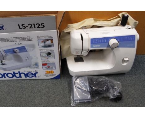 A Brother sewing machine model #LS-2125 with manual, power controller pedal, cover and original box This lot MUST be paid for
