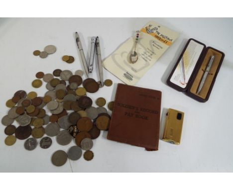 A good mixed lot of UK and Worldwide coins, a soldiers record and pay book Army book 64, a small collection of pens to includ