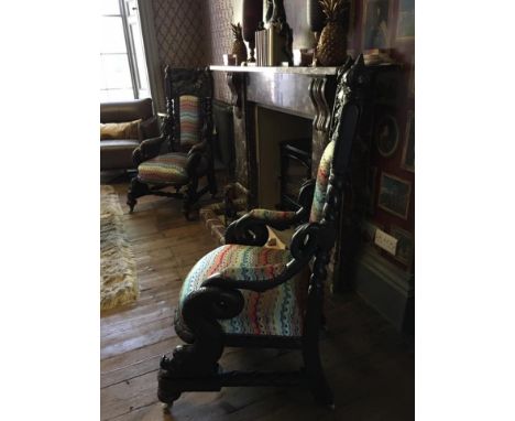 A Significantly Carved Vintage Armchair Reupholstered In A Vibrant Colour Way Fabolusly Carved Depicting Carvings Of Birds An