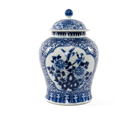 CHINESE BLUE & WHITE JAR & COVER, painted with two panels of birds and peony issuing from rockwork, reserved on lotus scrolli