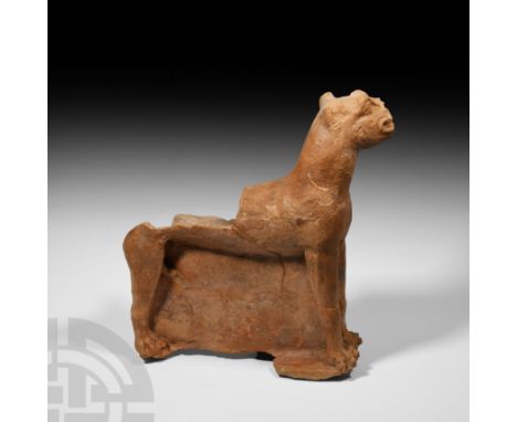 Circa 5th-4th century B.C. A substantial terracotta panther sculpture, the animal standing alert and with head turned upwards