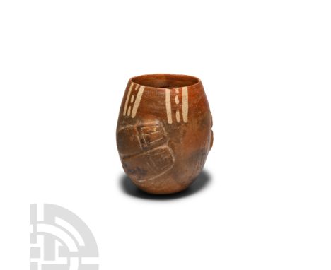 16th century A.D. or earlier. A polychrome ceramic cup or other vessel with a roughly ovoid body, geometric patterns painted 