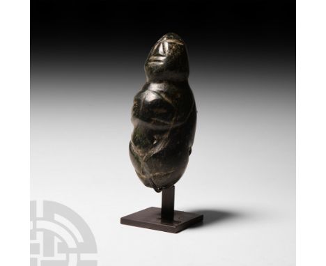 Mezcala, Guerrero, 150 B.C.-250 A.D. A green jade figure depicted kneeling with hands held together in front of the chest, st
