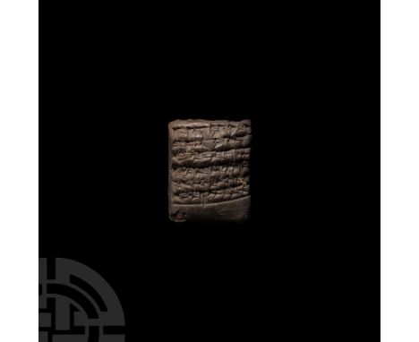 Early 2nd millennium B.C. A ceramic tablet bearing multiple lines of cuneiform text to two faces; roughly cuboidal in shape, 