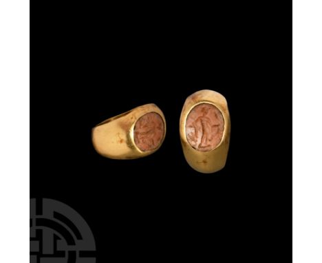 1st-2nd century A.D. A gold finger ring with inset ellipsoid jasper cloison, intaglio Mercury standing with caduceus in one h