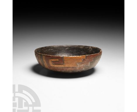 Circa 5th-4th century B.C. A ceramic bowl decorated with a polychrome incised geometric rim; rounded base. Cf. The Metropolit