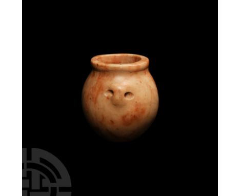 Late Predynastic-Early Dynastic Period, 3100-2850 B.C. A pink marble or alabaster kohl pot of fusiform shape, two horizontal 