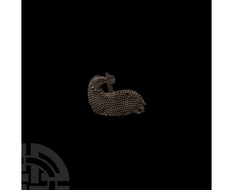 15th century A.D. A large lead-alloy pilgrim's badge fragment depicting a regardant lamb with textured fleece holding a staff