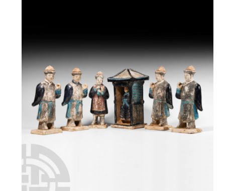 Ming Dynasty, 1368-1644 A.D. or later. A processional group of glazed ceramic and painted figures comprising: four bearers in
