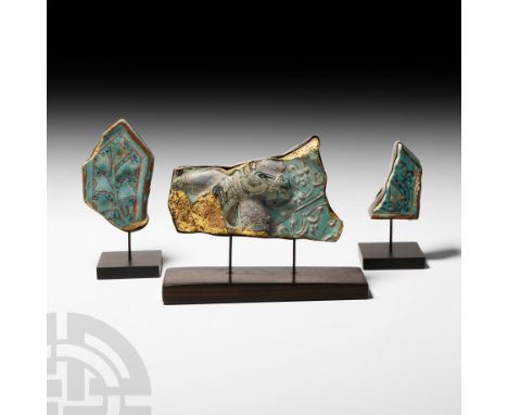 13th-16th century A.D. A trio of blue glazed ceramic tile fragments comprising: one displaying the head and neck of a horse f