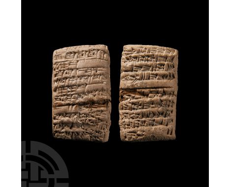 18th century B.C. A ceramic pillow-shaped tablet with biconvex cross-section; displaying impressed cuneiform text to both bro