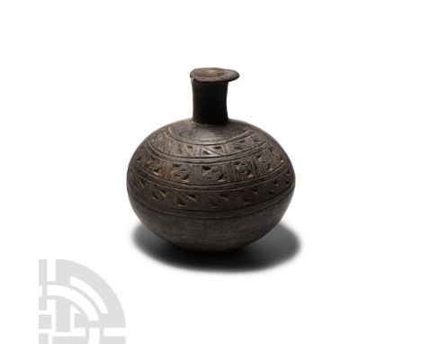 9th-15th century A.D. A black ware vessel of roughly capsule form, cylindrical neck and everted rim, decorated with two cresc