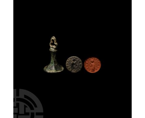 13th-14th century A.D. A copper-alloy seal matrix featuring an openwork trefoil terminal, waisted hexagonal-section stem with