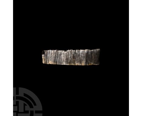 1st-3rd century A.D. A rectangular sheet-lead panel with columns of lightly incised Aramaic text; the sheet originally rolled
