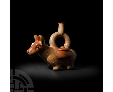 1st-6th century A.D. A bichrome ceramic stirrup vessel in the form of a llama, modelled standing with stylised anatomical fea