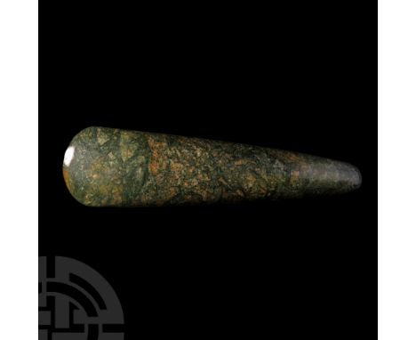 Neolithic Period, 7th-4th millennium B.C. A very fine and large polished mottled green rhyolite axe head, the round butt tape