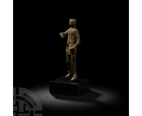 1st-2nd century A.D. A copper-alloy figure of the god Mercury (Greek Hermes), modelled standing with his left foot placed sli