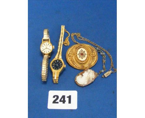 A Victorian 9ct gold brooch set with seed pearls and a ruby, a cameo on necklace and two ladies wrist watches.       