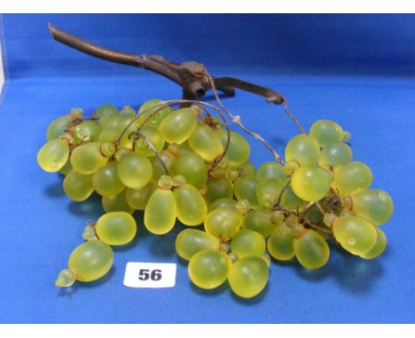 An unusual small hanging lamp, c1900, in the form of a branch with a glass bunch of grapes shade. Multiple green glass grapes