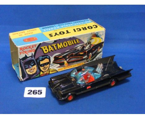 A Corgi 267 Batmobile boxed in outer box only, red bat to wheels, car in good condition, box missing one end.