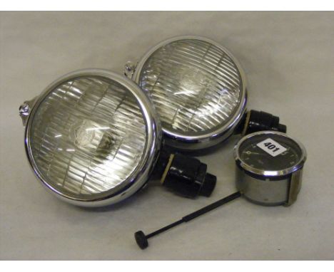 Two boxed vintage Lucas fog lamps and a Smith car clock.   