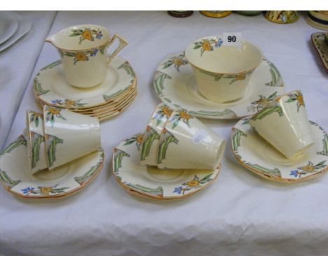 An Art Deco style Alfred Meakin part tea service with stylised floral decoration on a cream ground, approx. 20 pieces.