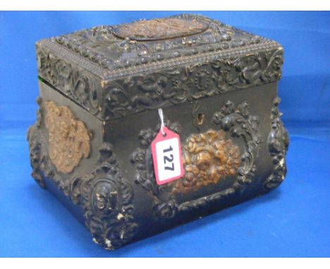 A highly decorative 19th Century tea caddy in tooled leather and wood.