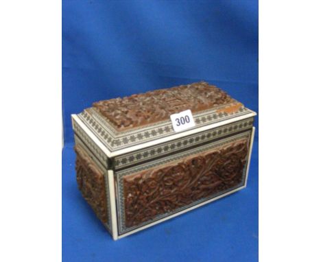 An Oriental tea caddy with internal zinc liners having mother of pearl and bone inlay to all surfaces and interior, decorated