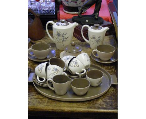 A two tone Poole Pottery tea for two set and matching six place setting coffee service in beige and brown.