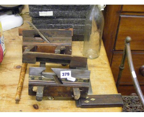 Two vintage moulding planes, a set square, a fork and a Victorian bottle.