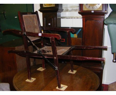 A Carters vintage sedan style folding invalid chair with caned seat and back and brass plaque "Presented by Viscountess Snowd