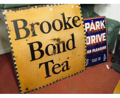 Two enamel vintage advertising signs, one for Brooke Bond Tea, the other Park Drive Cigarettes.