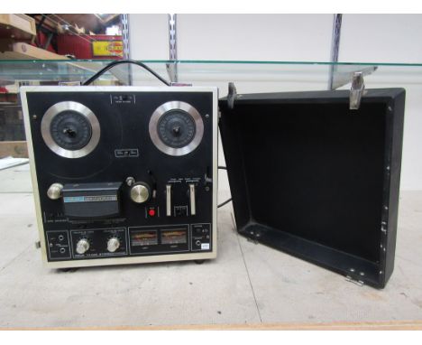 An Akai 1721L four track stereophonic reel to reel tape recorder