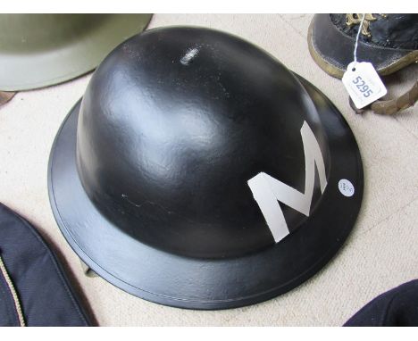 A British Type II helmet, re-painted, later liner 