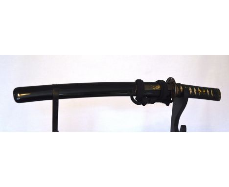 A circa 1750 Japanese wakizashi with un-signed hiza-zukuri. The blade measures 285mm from tip to mune-machi, 30mm wide and 8m