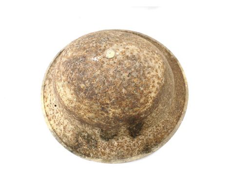 A WWI British Type I helmet converted for use during WWII (later liner) 