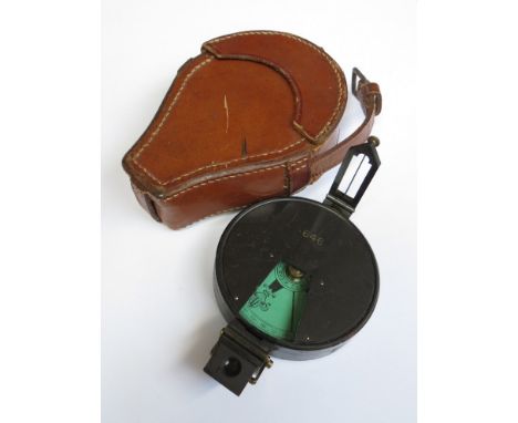 A WWI era Hicks & Son compass with brown leather case, numbered 646