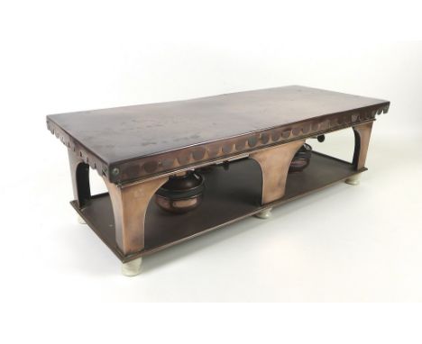 An Alexander Boyd of London copper chafing stand with two copper burners, on four ceramic feet, 61 by 24cm and 18cm high.