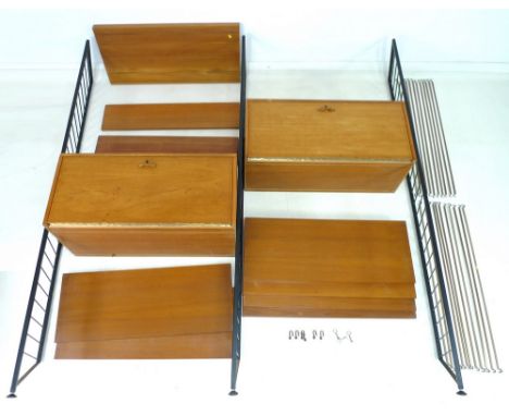 A set of adjustable shelving, probably by Ladderax, Staples, circa 1970, comprising three black painted uprights, fall front 