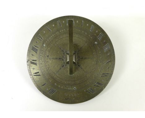 An 18th century brass sundial, the body engraved with Roman numeral along with 'Watch Faster' and 'Watch Slower' also engrave
