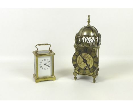 A French brass cased carriage clock, 8 by 6.5cm and 11cm high, together with a brass lantern clock, with Roman numerals on th