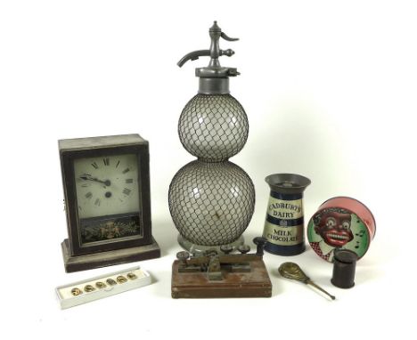 A collection of 20th century tin money boxes, including a Cadbury's Dairy lighthouse, 14cm high, a Chad Valley mechanical Lit