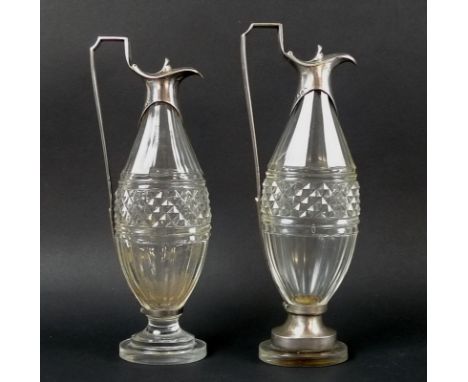 Paul Storr - A pair of George III silver mounted cut glass oil and vinegar bottles with almost zoomorphic beak spouts and hin