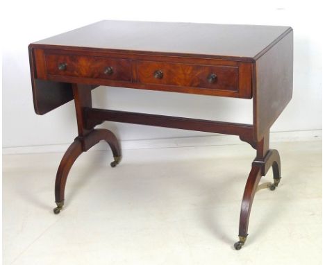 A 19th century cross banded mahogany sofa table, two frieze drawers with cock beading and turned handles, shaped base with st