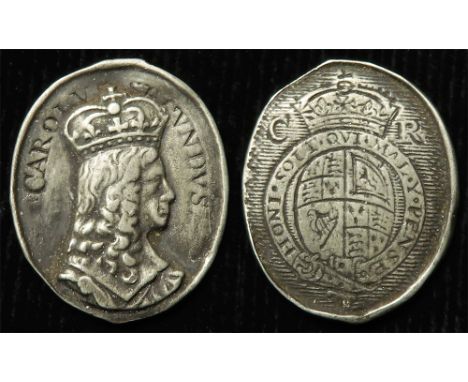 Royalist Badge, cast silver 20.5x24.5mm, 2.63g: Charles II 'CAROLVS SECVNDVS' portrait r. / Engraved coat of arms. Believed t