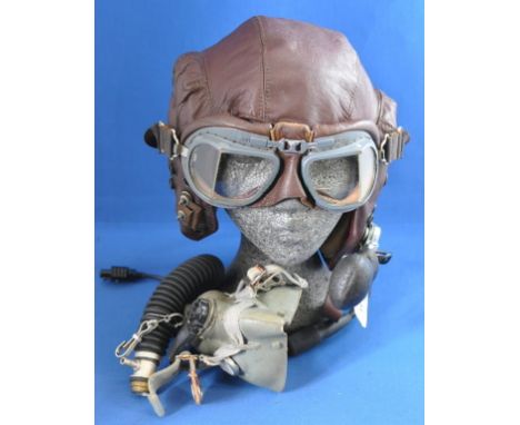 A RAF issue leather flying helmet, the ear pieces inscribed Henley, together with Airmed microphone, leather lined goggles, R