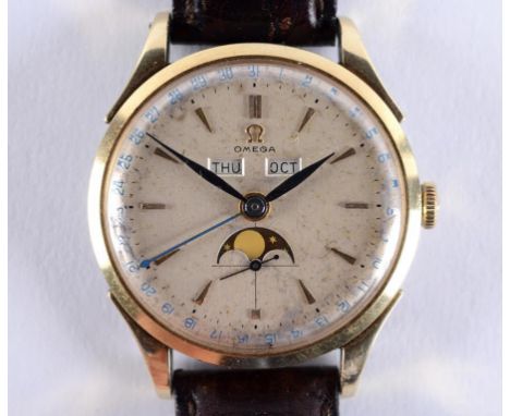 A gentleman's gold and stainless steel Omega Cosmic wristwatch with baton indices, centre seconds, day, month and phase of th