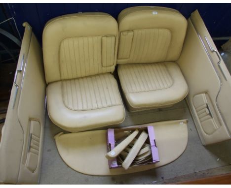 A 1960s Maserati interior, finished in cream leather, comprising a pair of front seats, two door cards and other items  Condi